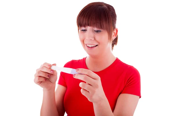 De jonge vrouw met een zwangerschapstest — Stockfoto