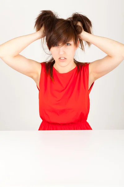 The young woman is tearing her hair — Stock Photo, Image