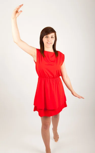 The young woman is dancing in front of the camera — Stock Photo, Image