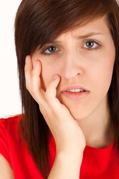 The young woman has got toothache and is holding her cheek — Stock Photo, Image