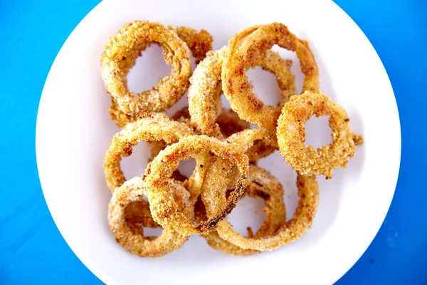 Top view of baked onion rings snack — Stock Photo, Image