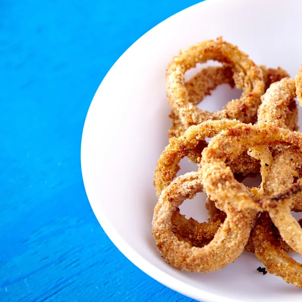 Baked onion rings snack — Stock Photo, Image