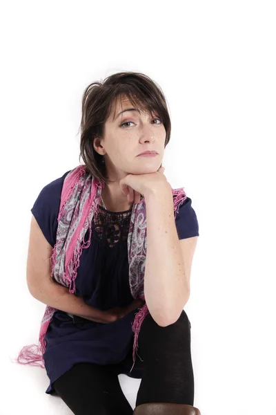 Portrait of a young woman with hand under mouth — Stock Photo, Image