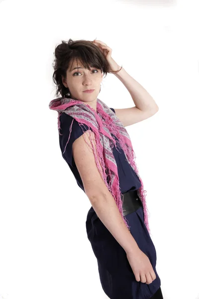 Young brunette woman playing with her hair isolated on studio — Stock Photo, Image