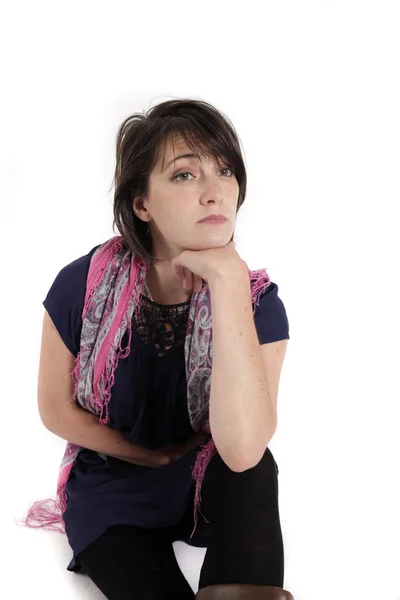 Portrait of a young woman with hand under mouth — Stock Photo, Image