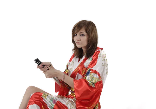 Francia fiatal lány gésa japán kard piros selyem kimonó — Stock Fotó