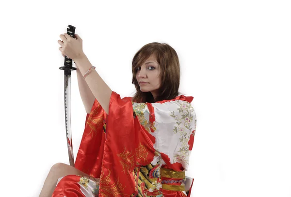 French young girl geisha in red silk kimono with japanese sword — Stock Photo, Image