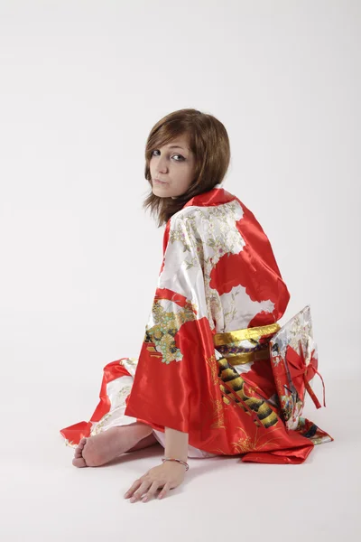 French young girl geisha in red silk kimono — Stock Photo, Image