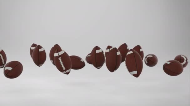 Rendering American Football Balls Falling Grey Background Footage — Stok video