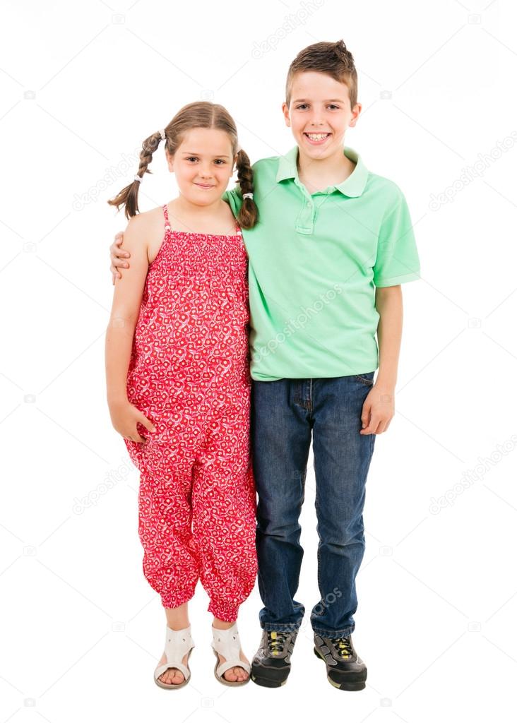 Full body portrait of two children standing over white backgroun