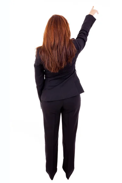 Jeune femme d'affaires pointant quelque chose, isolé sur ba blanc — Photo