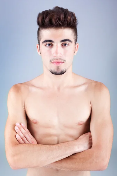 Handsome young man portrait on grey background — Stock Photo, Image