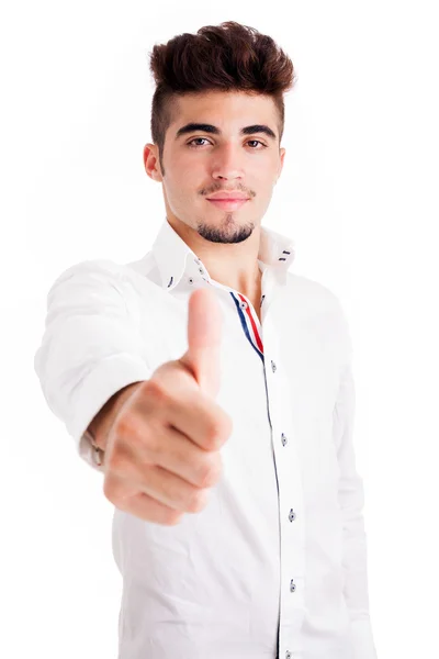 Sonriente joven casual hombre pulgares ups, aislado en fondo blanco —  Fotos de Stock