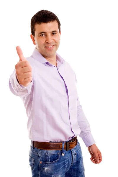 Boldog, hétköznapi fiatal ember találat hüvelykujjával felfelé, és mosolyogva, elszigetelt — Stock Fotó