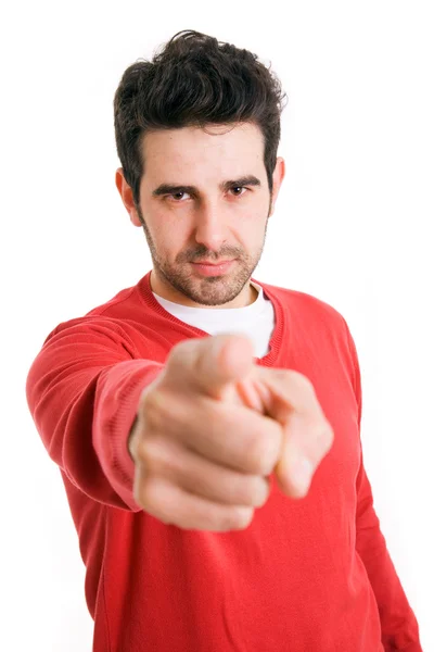 Portrait of a handsome young man pointing finger at you against — Stock Photo, Image