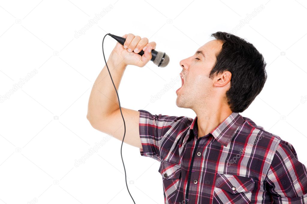 handsome young man singing to the microphone, isolated on white