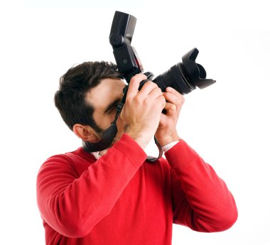 beyaz zemin üzerinde kamera ile profesyonel fotoğrafçı