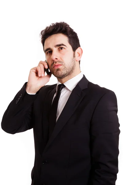 Retrato de um jovem homem de negócios com telefone isolado em branco ba — Fotografia de Stock