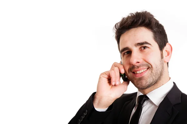 Young business man talking on the phone, isolated on white — Stock Photo, Image