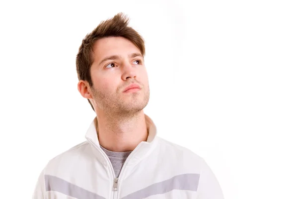 Thinking young man looking up on white background — Stock Photo, Image