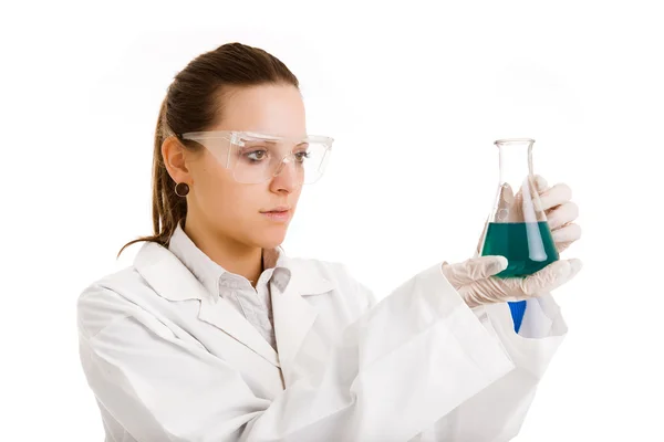 Isolated scientist woman in lab coat with chemical glassware — Stock Photo, Image