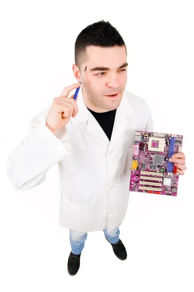 Pensive Computer Engineer holding a motherboard, isolated on whi — Stock Photo, Image