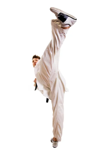 Young man practicing martial arts over white background — Stock Photo, Image