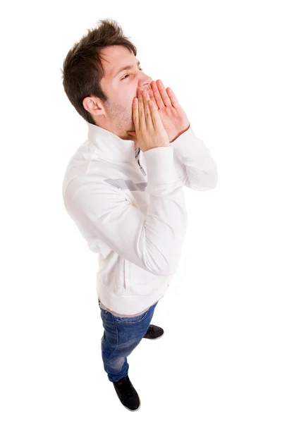 Young man shouting loud with hands on the mouth, isolated on whi Royalty Free Stock Images