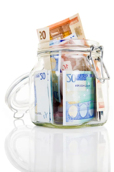 Glass money jar of Euro banknotes Stock Picture