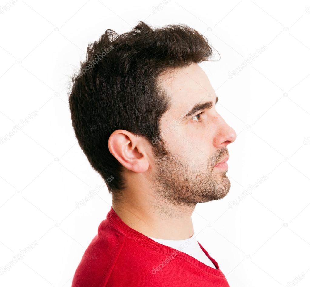 Profile view of young man in red shirt, isolated on white
