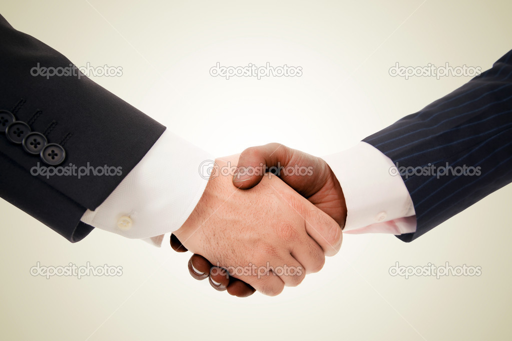Closeup of a multiracial handshake between two business men