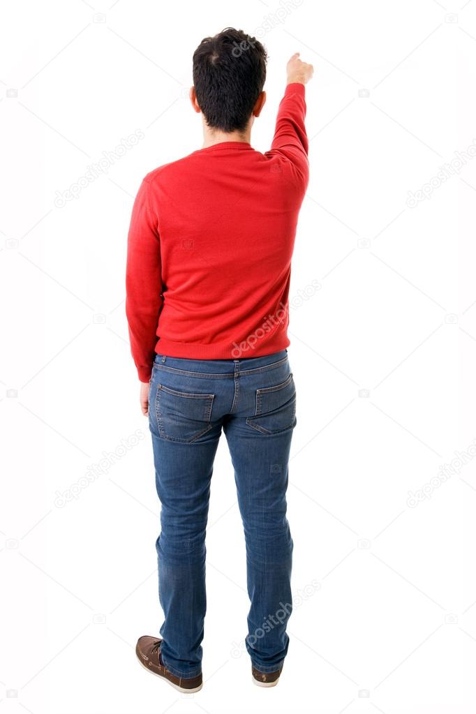 Young man pointing from back, isolated on white
