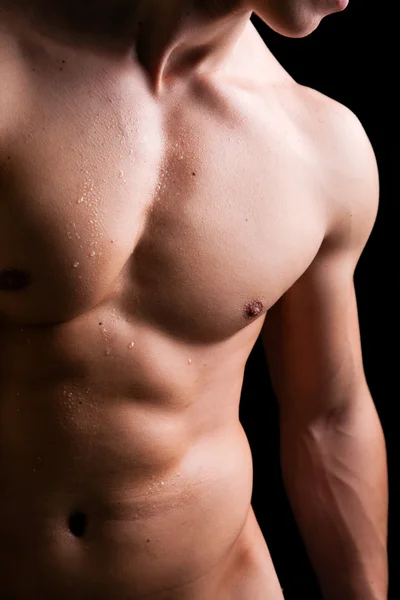 Muscle man torso with drops a water — Stock Photo, Image