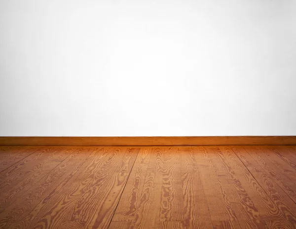 Leere weiße Wand und Holzboden — Stockfoto
