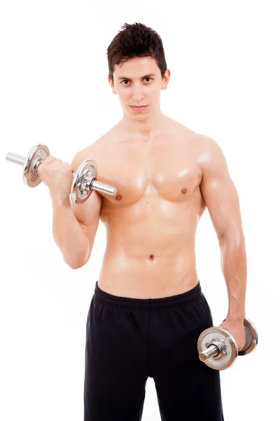 Muscled young man lifting weights, isolated on white — Stock Photo, Image