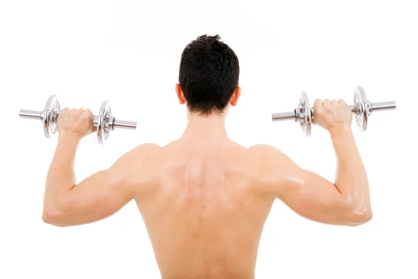 Youg man lifting weights on back, isolated on white — Stock Photo, Image