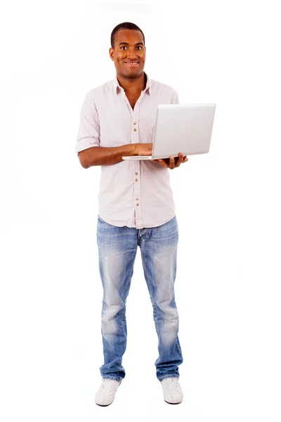 Full length portrait of young african man with laptop, isolated on white — Stock Photo, Image