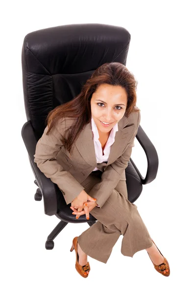 Beautiful young business woman sitting on chair isolated over white background — Stock Photo, Image