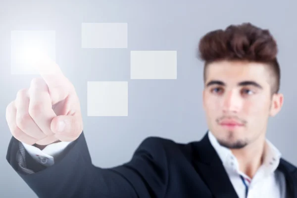 Hombre de negocios pulsando un botón en una interfaz de pantalla táctil —  Fotos de Stock