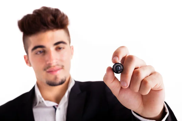 Happy young business man drawing on empty copy space, isolated on white — Stock Photo, Image