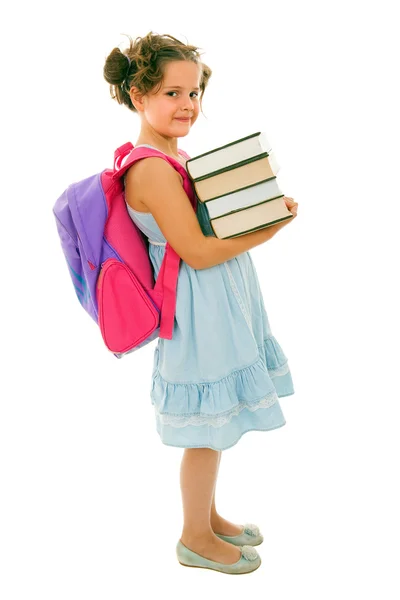 Kleines Mädchen mit Rucksack und Büchern, isoliert auf weißem Hintergrund — Stockfoto