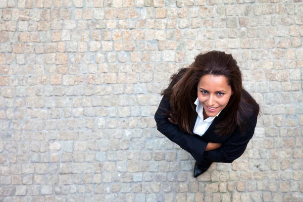 Portrait of a cute young business woman looking up — Stock Photo, Image