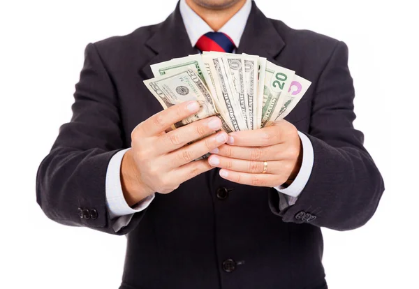 Affärsman som håller pengar på vit bakgrund — Stockfoto