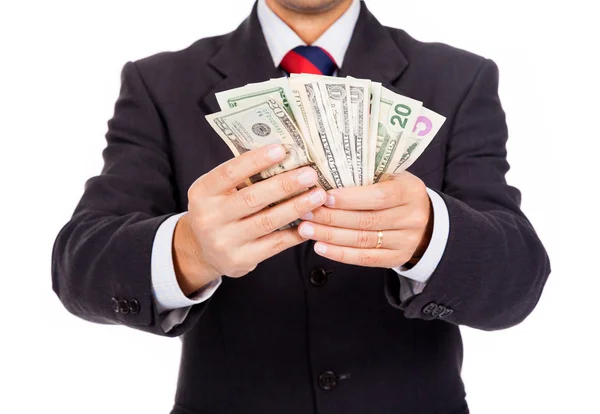 Business man holding money on white background — Stock Photo, Image