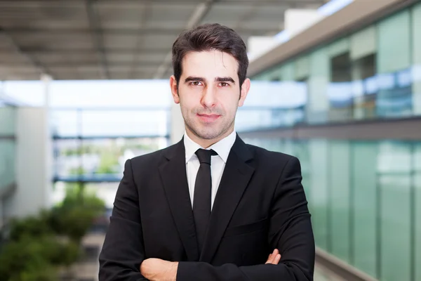 Closeup portrait of a happy young business man at modern office — Stock Photo, Image