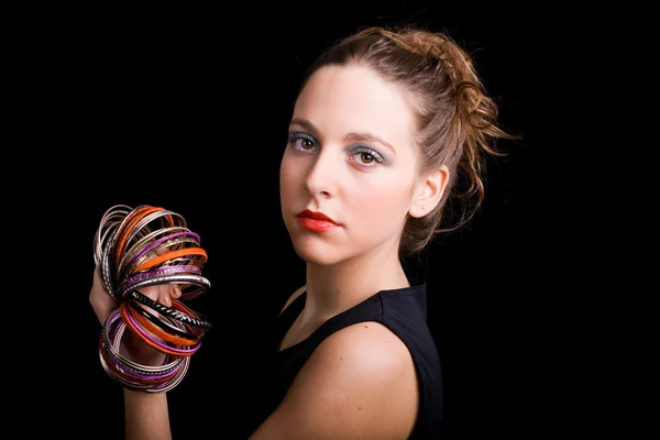 Young beautiful woman close up portrait against black background — Stock Photo, Image