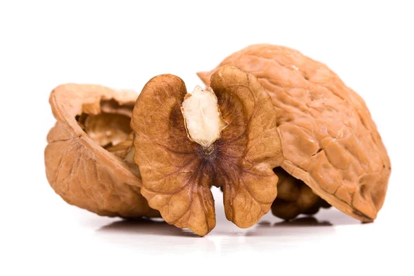 Walnut and a cracked walnut isolated on the white background — Stock Photo, Image