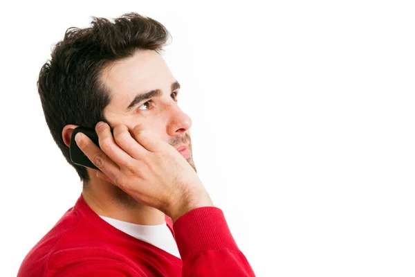 Homem feliz ao telefone contra um fundo branco — Fotografia de Stock