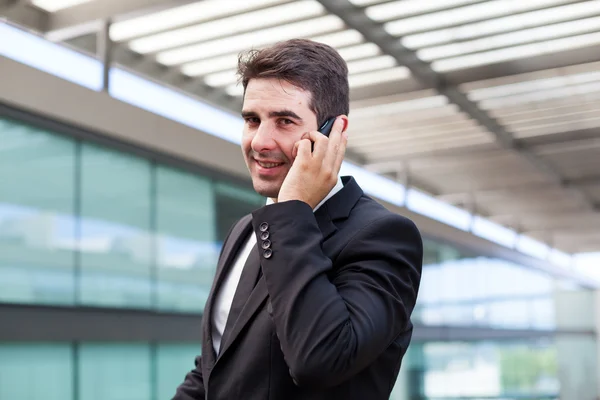 Young business man talking on cell phone at modern office Stock Photo
