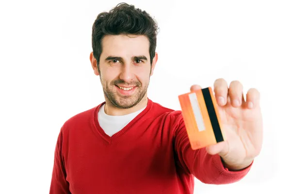 Gelukkig lachend jongeman weergegeven: creditcard geïsoleerd op witte achtergrond Stockfoto